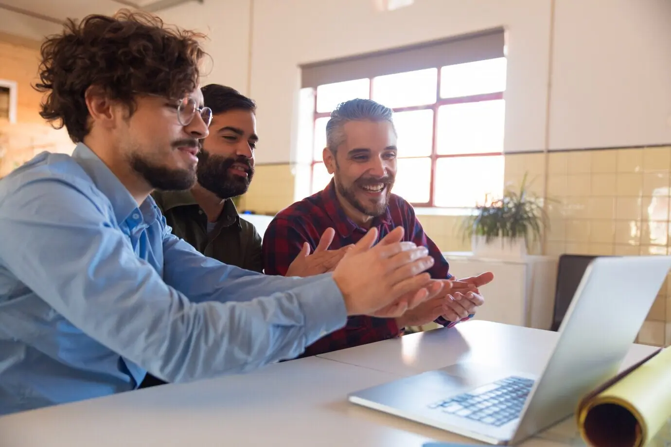A group of colleagues watching an online training session or a webinar.