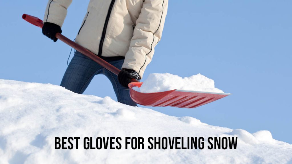 a man is shoveling snow with gloves